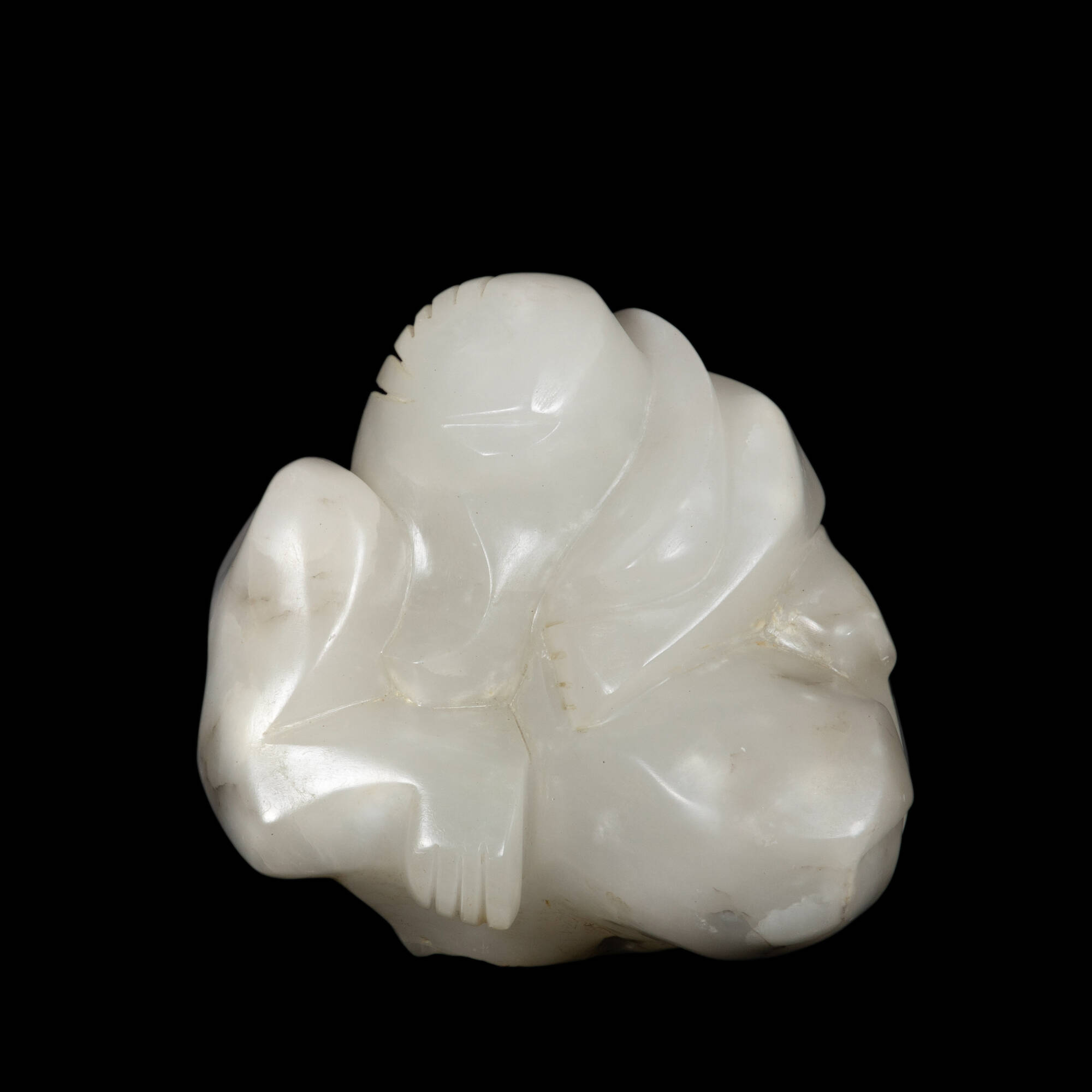 White marble sculpture with human elements.